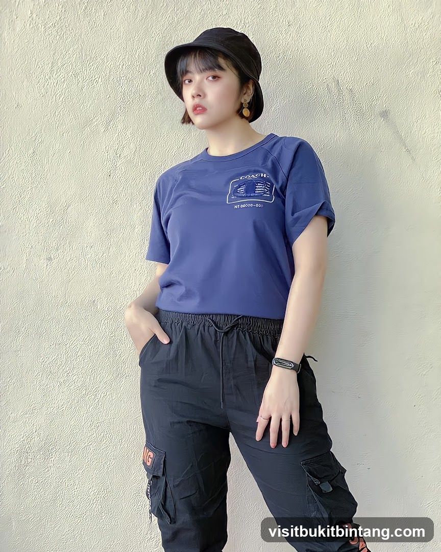 Woman in Blue T-shirt and Black Cargo Pants
