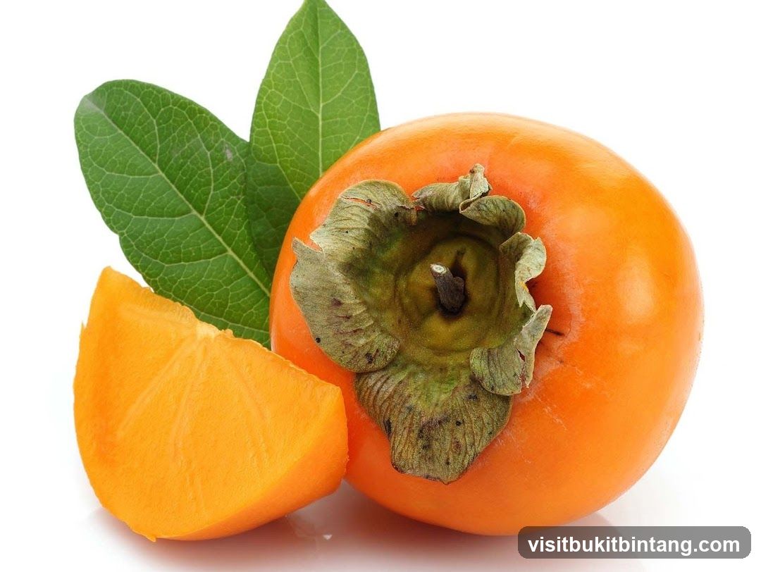 Persimmon with a slice and leaves