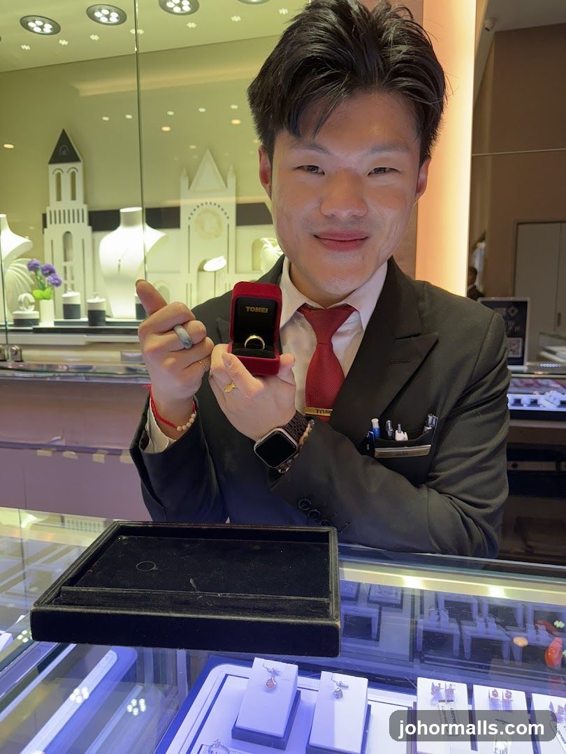 Jewelry Store Employee Showing a Ring