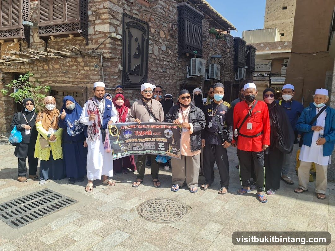 Group Posing with Umrah Banner