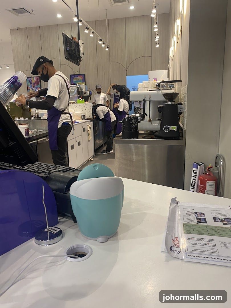 Staff preparing drinks behind a counter