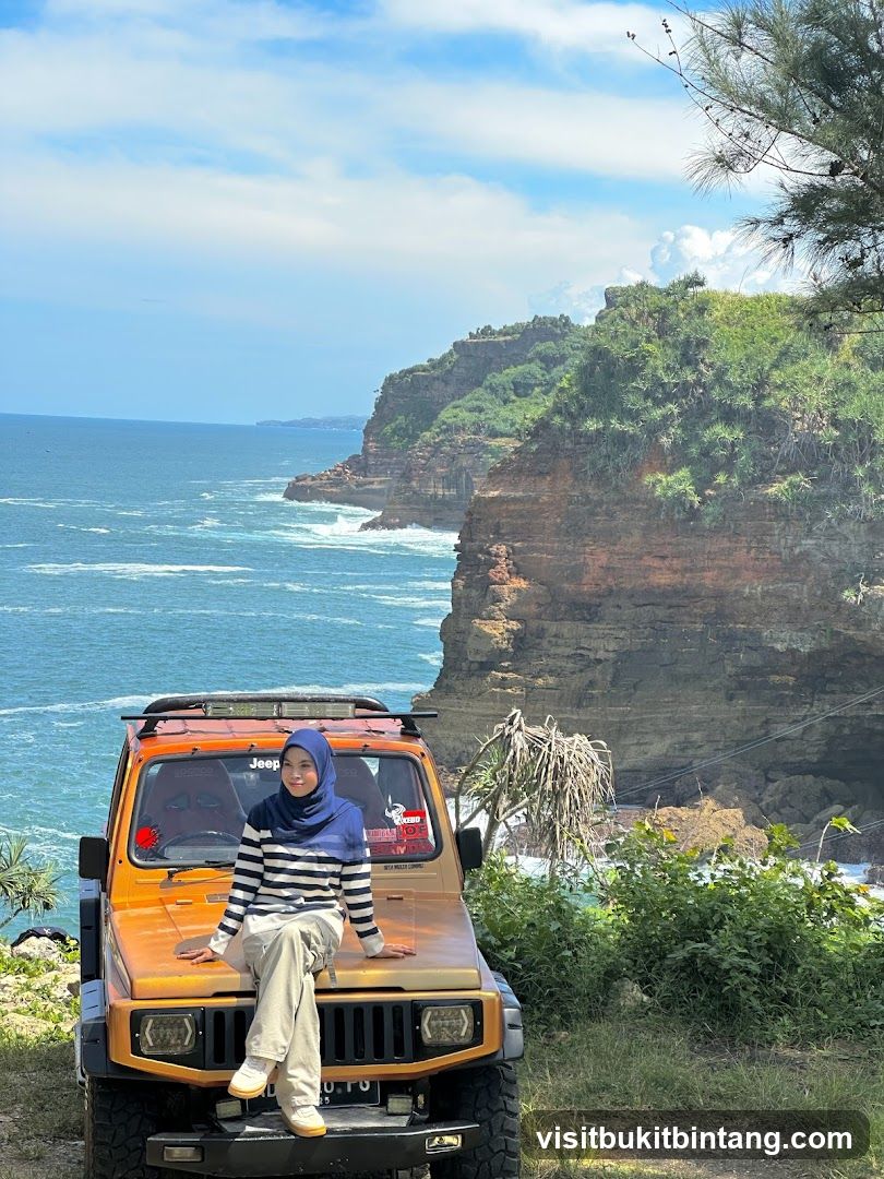 Woman Posing on a Jeep by the Ocean