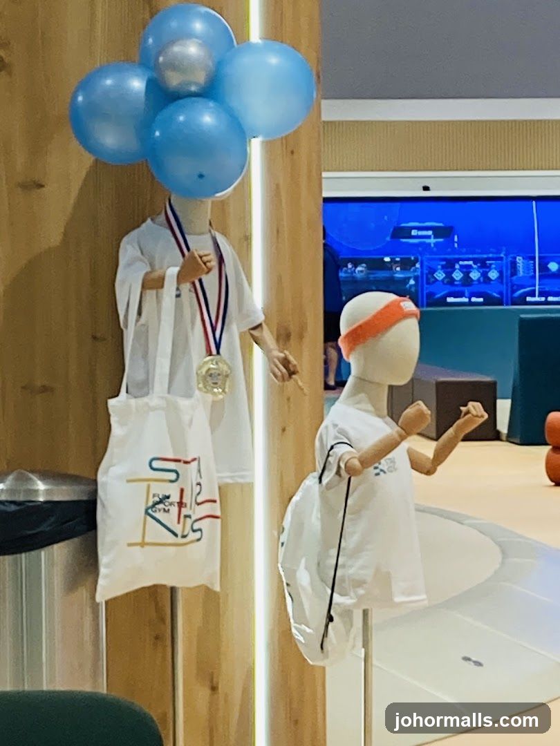 Mannequins with sports attire and medals