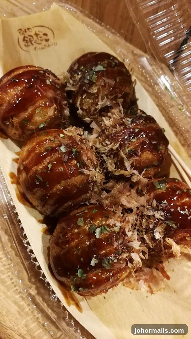 Takoyaki with sauce and bonito flakes