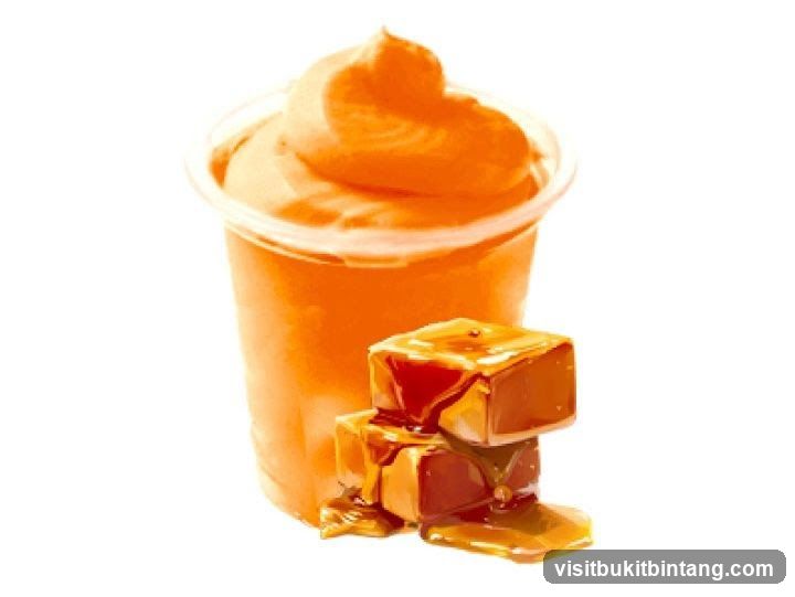 Orange Swirl Drink with Caramel Candies