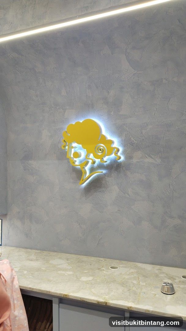 Illuminated Logo on Textured Wall