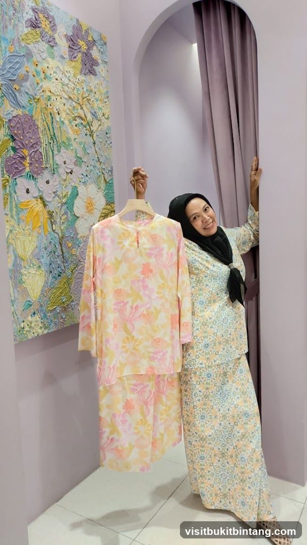 Woman holding a floral patterned outfit