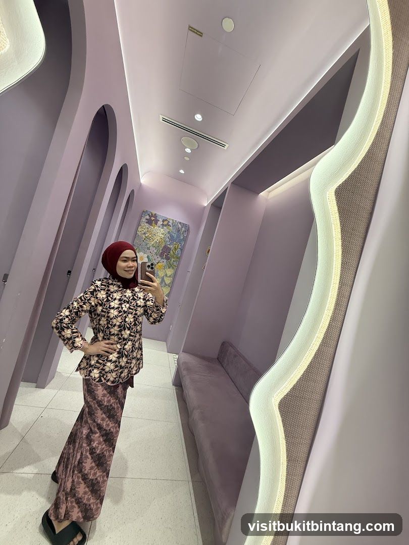 Woman in a patterned outfit taking a mirror selfie