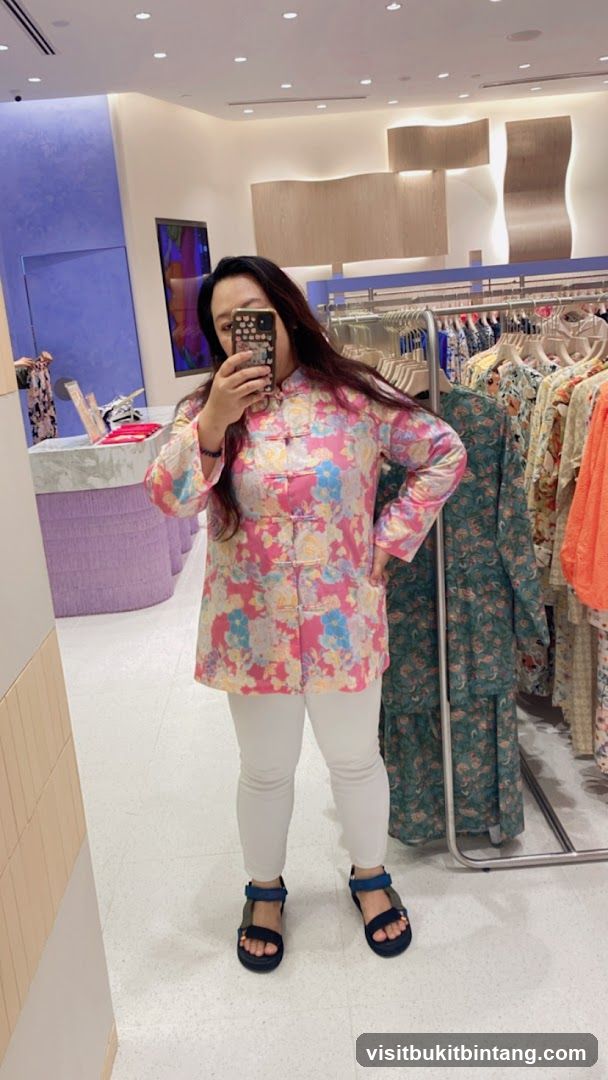 Woman in floral jacket trying on clothes