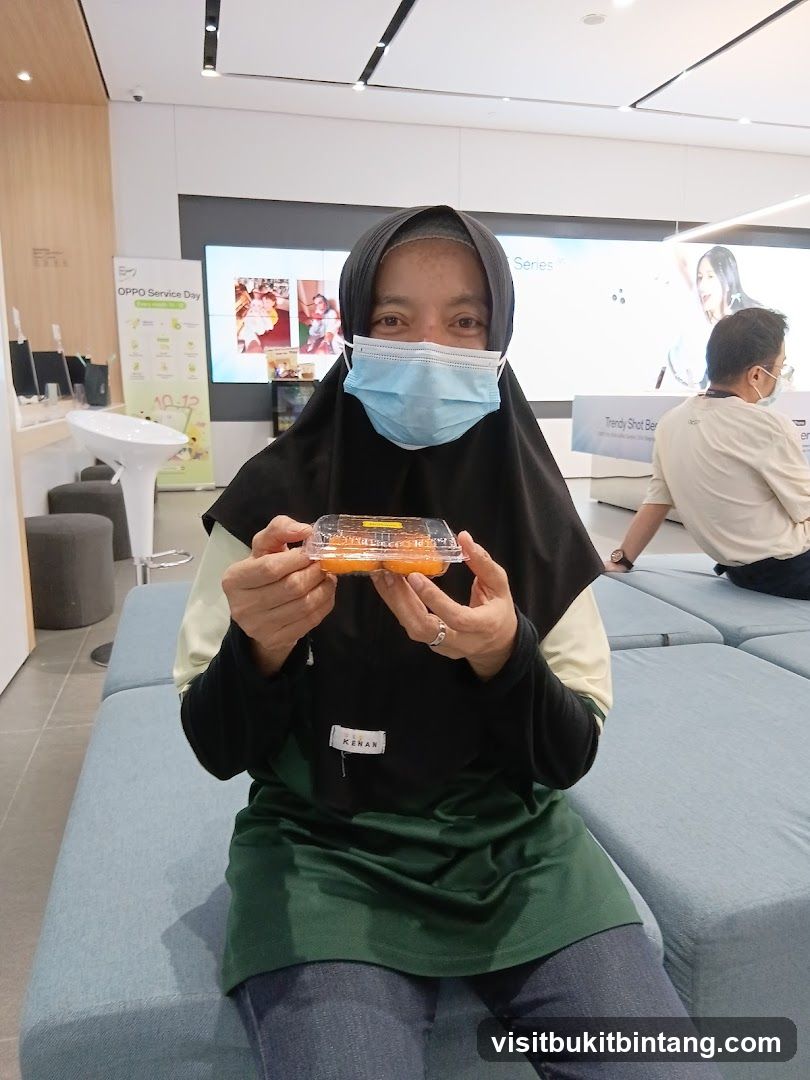 Woman holding a container of food