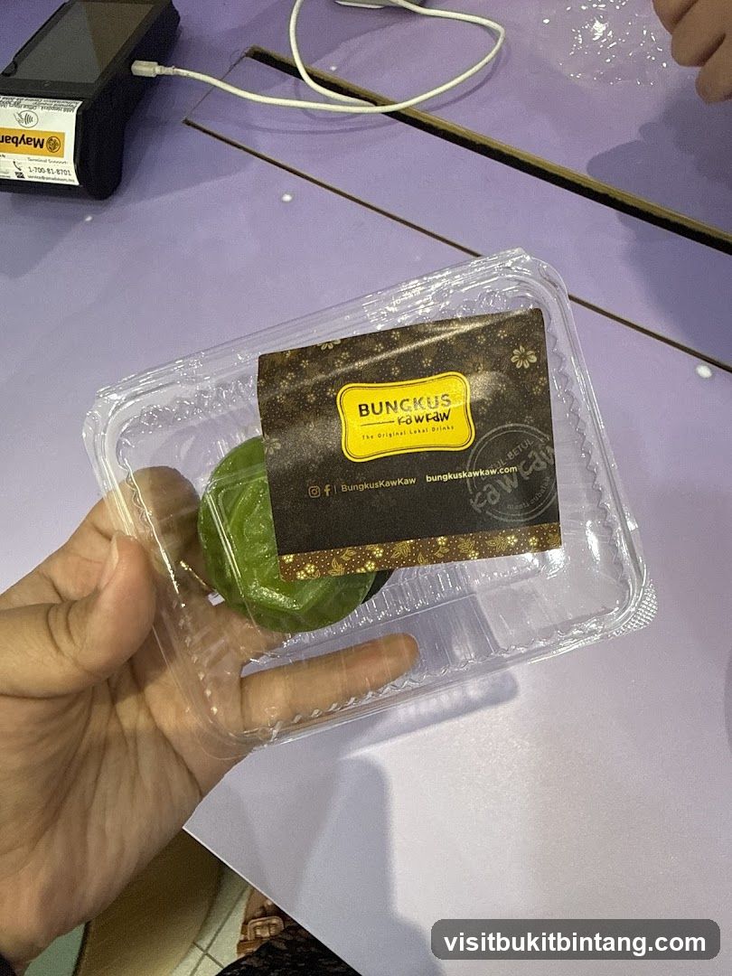Green dessert in plastic container