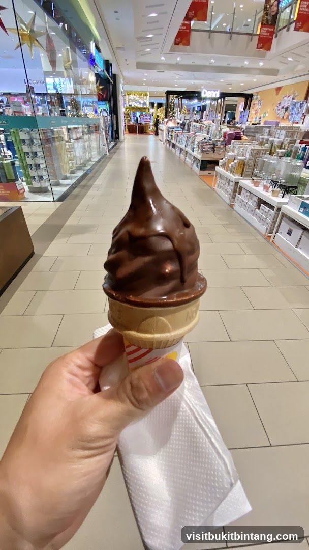 Chocolate soft serve ice cream cone