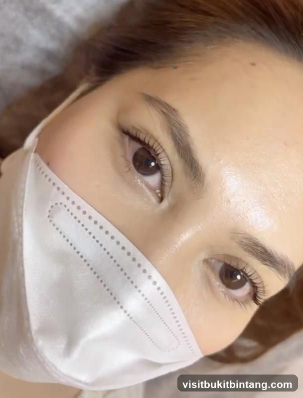 Close-up of a woman's eyes with a mask