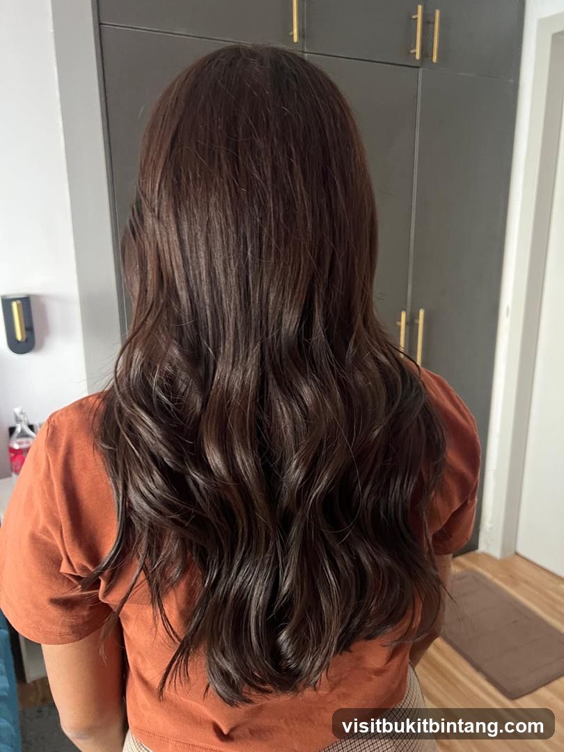 Woman with long, wavy brown hair
