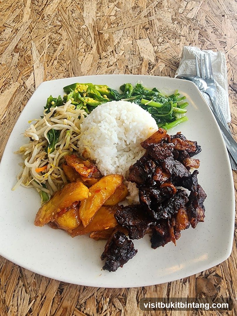 Plate of food with rice, vegetables, and meat
