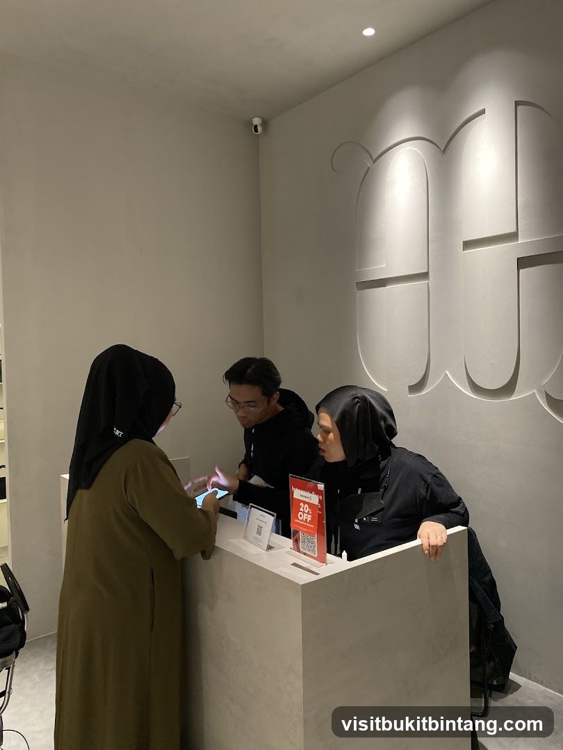 Staff assisting customers at a counter