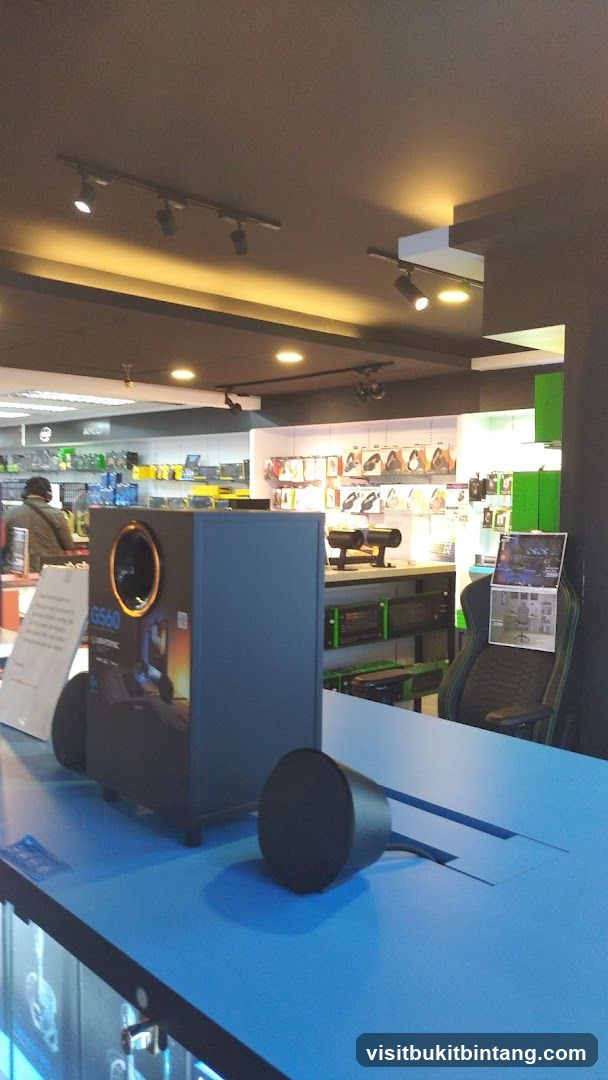 Electronics store interior with gaming equipment