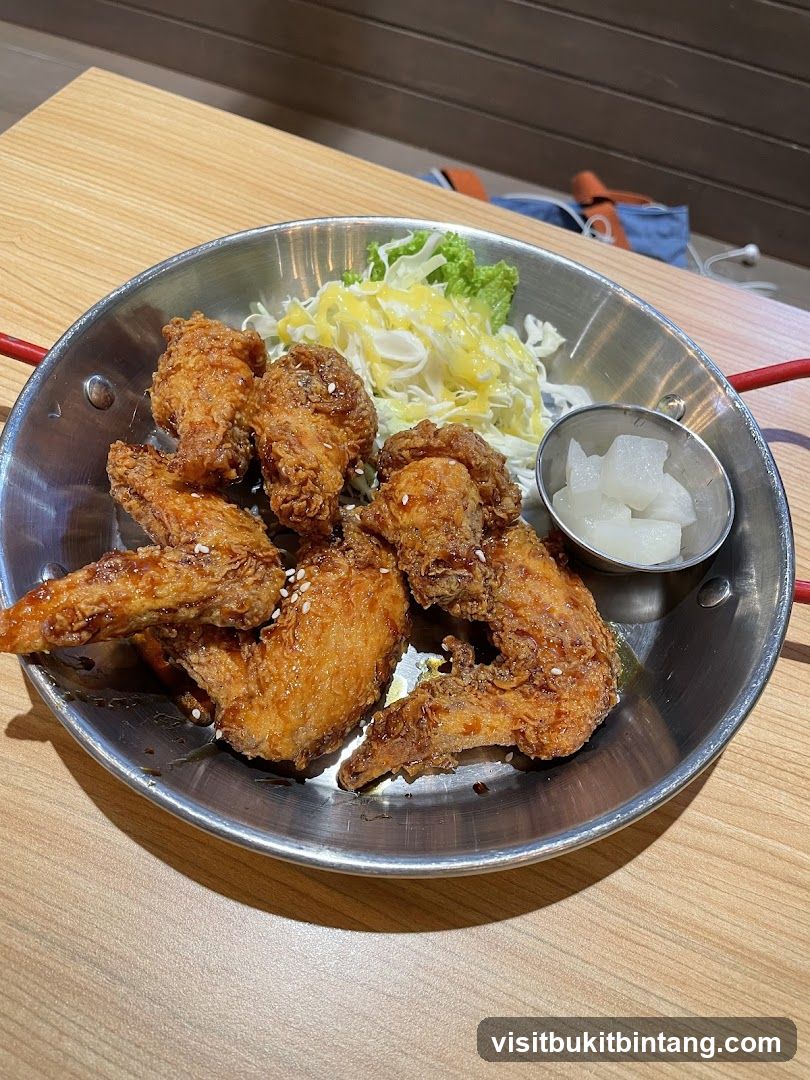 Fried Chicken Wings with Salad and Pickled Radish
