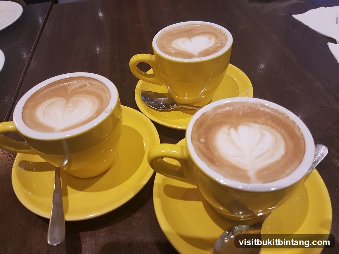 Three cups of coffee with latte art