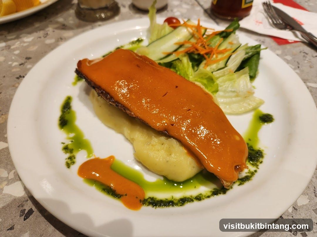 Fish dish with mashed potatoes and salad