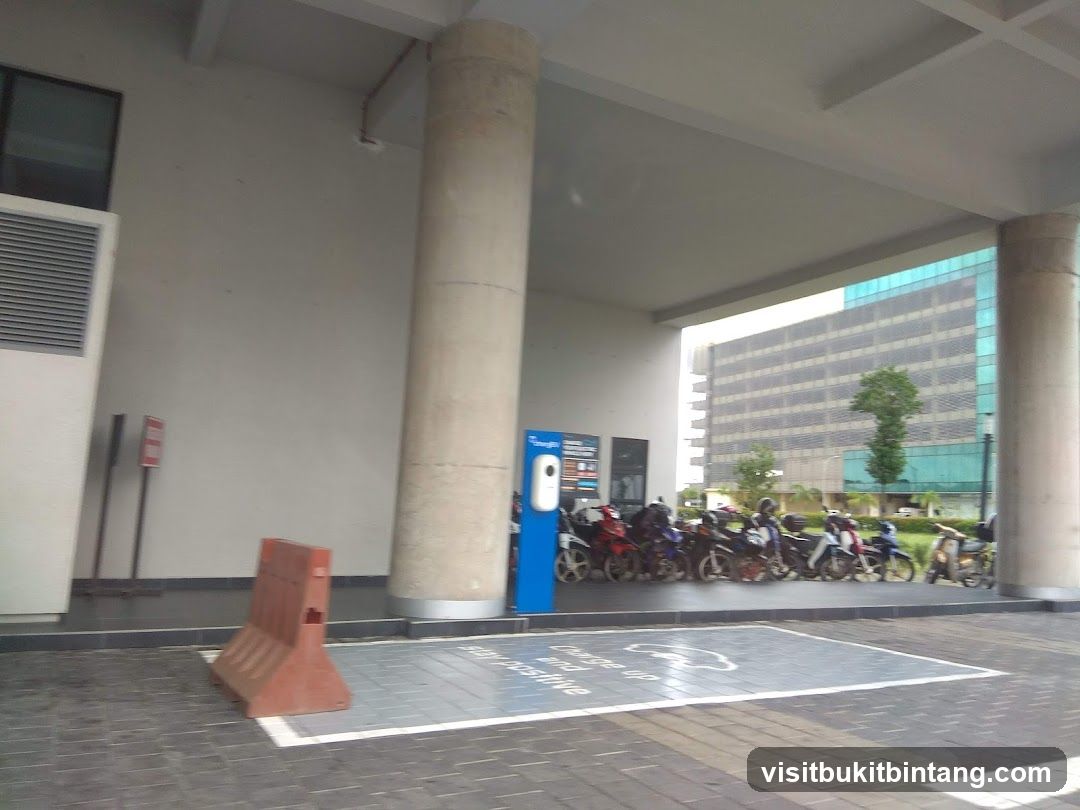 Motorcycle parking area with charging station