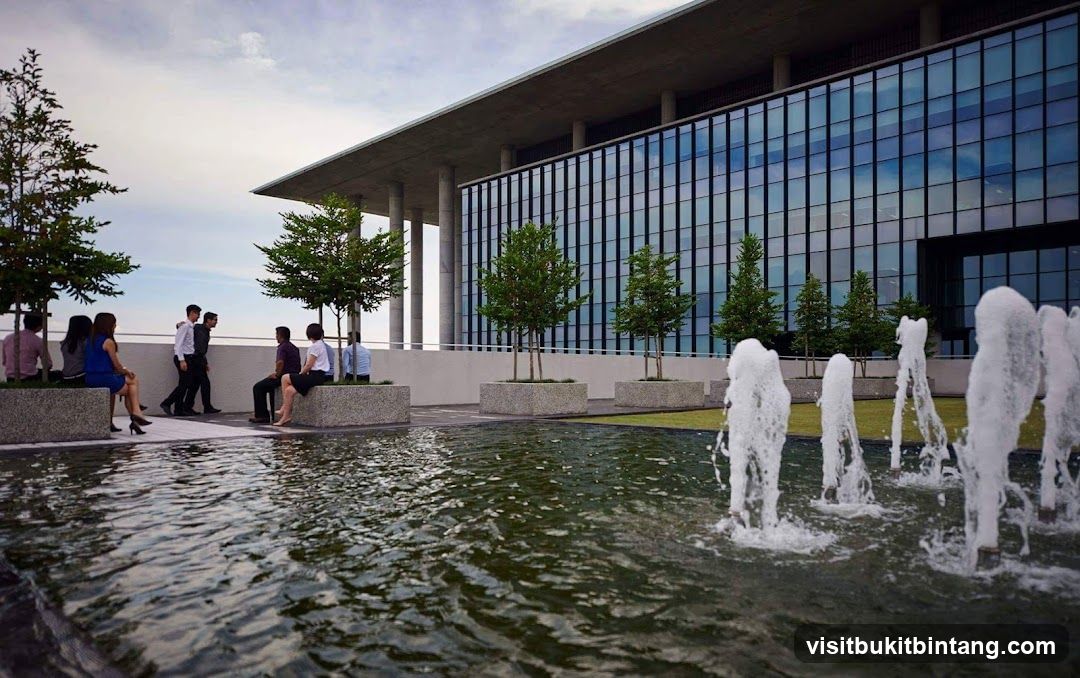 Modern Office Building with Outdoor Seating and Fountain