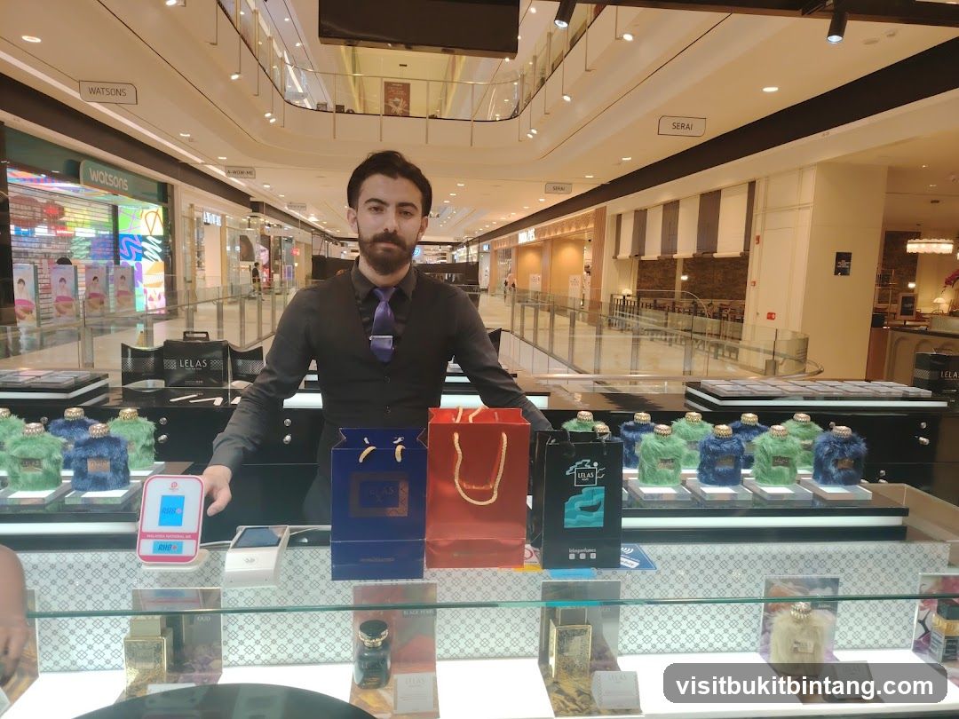 Perfume display with staff