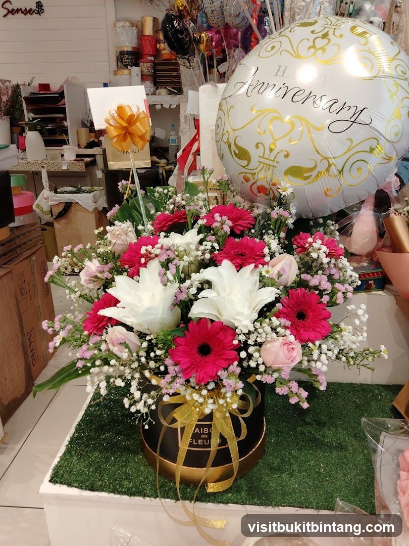 Flower arrangement with anniversary balloon