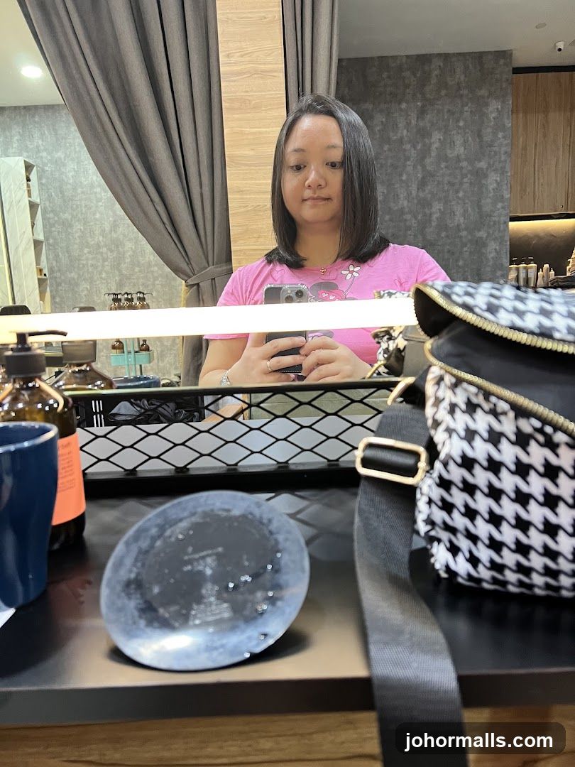 Woman taking a selfie in a salon