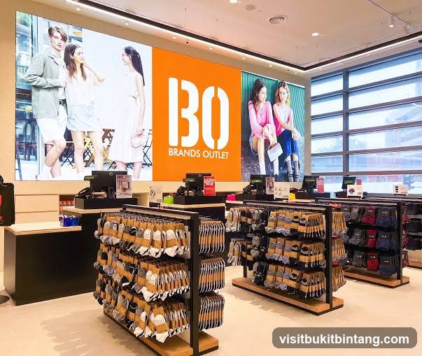 Clothing store interior with large digital display