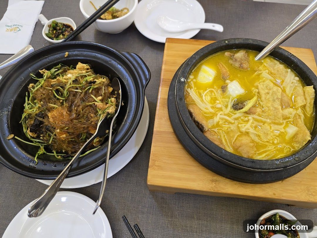 Two dishes of food on a table