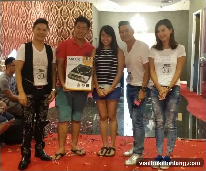 Group posing with a product