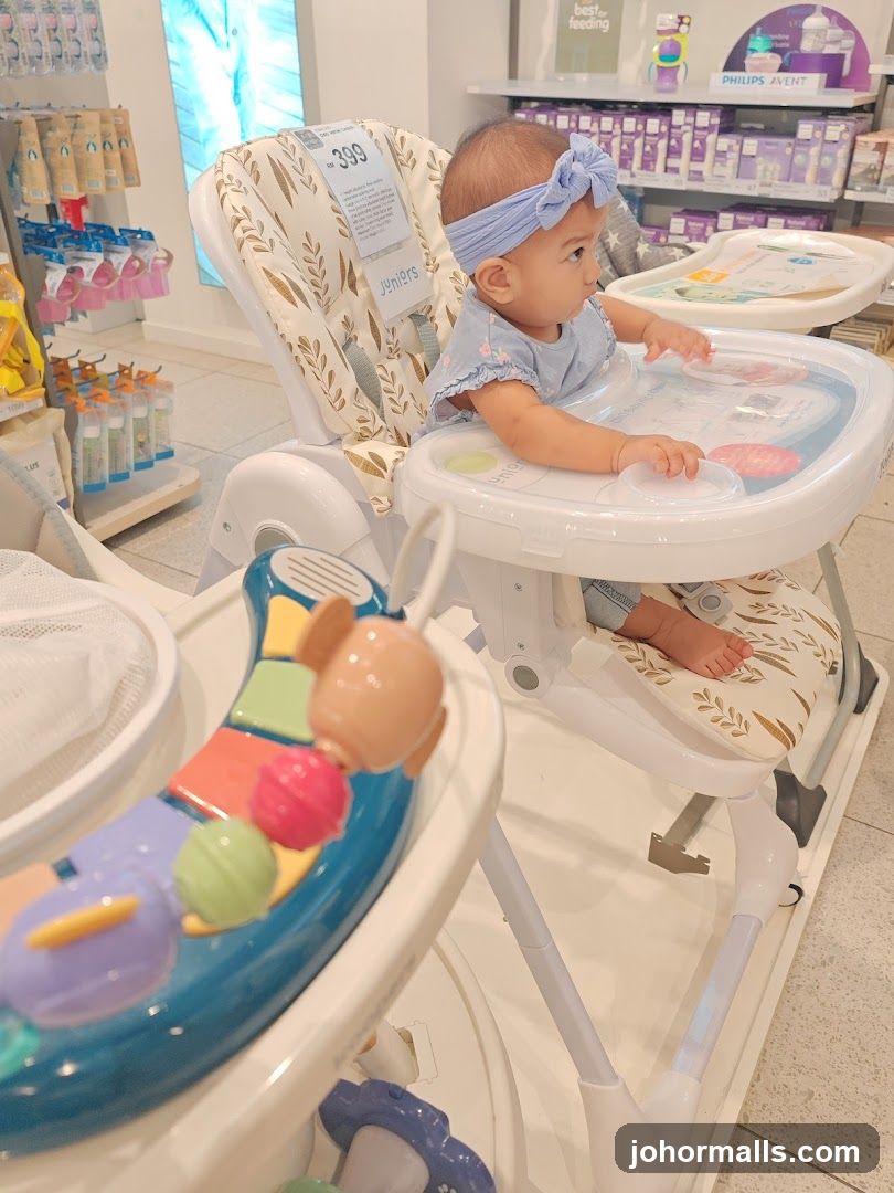 Baby in a high chair in a store