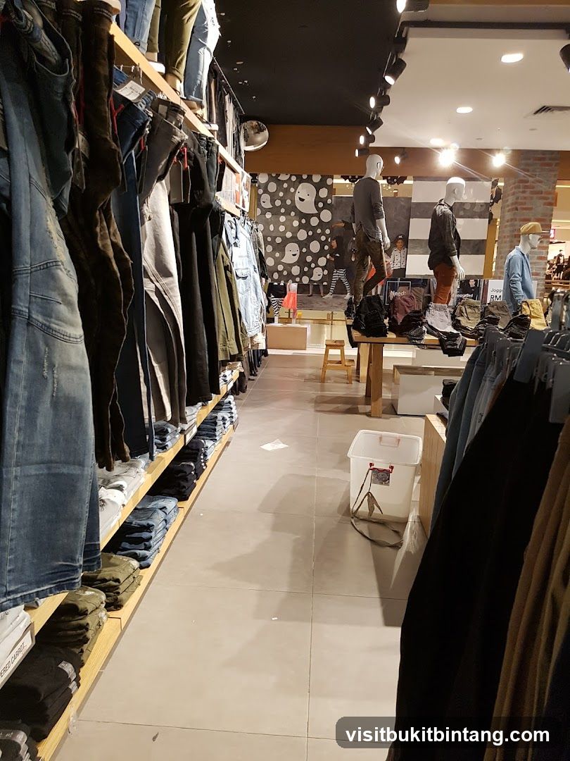 Clothing store interior with mannequins and apparel