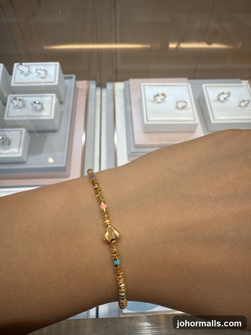 Gold Bracelet with Heart Charm