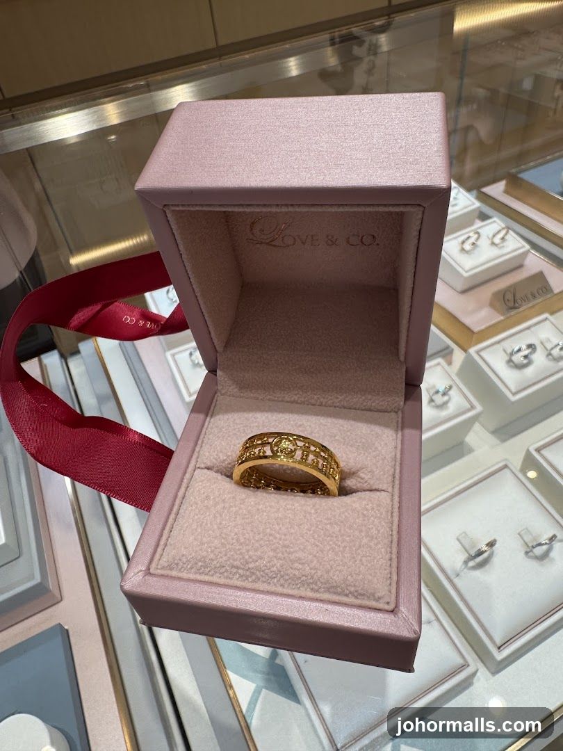 Gold ring in a pink jewelry box