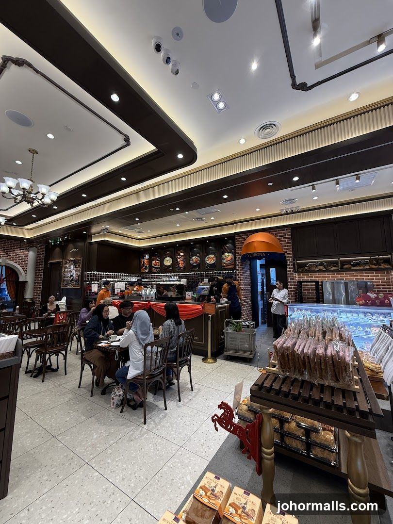 Interior of a cafe with seating and display cases