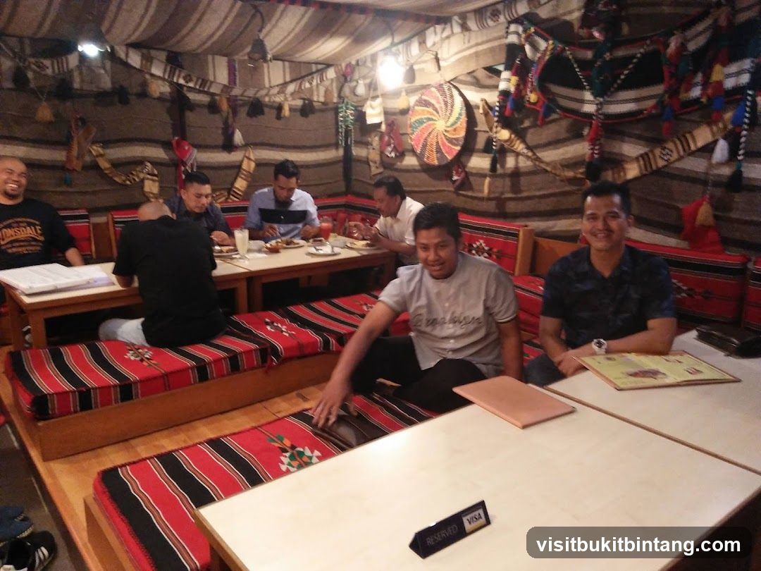 People dining in a tent-like restaurant