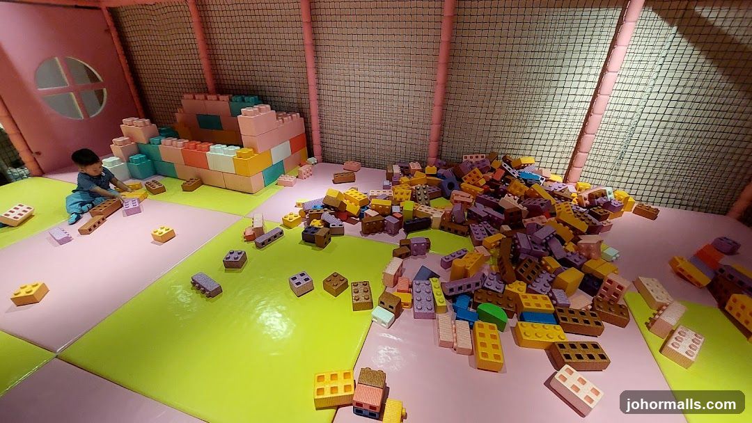 Child playing with large building blocks