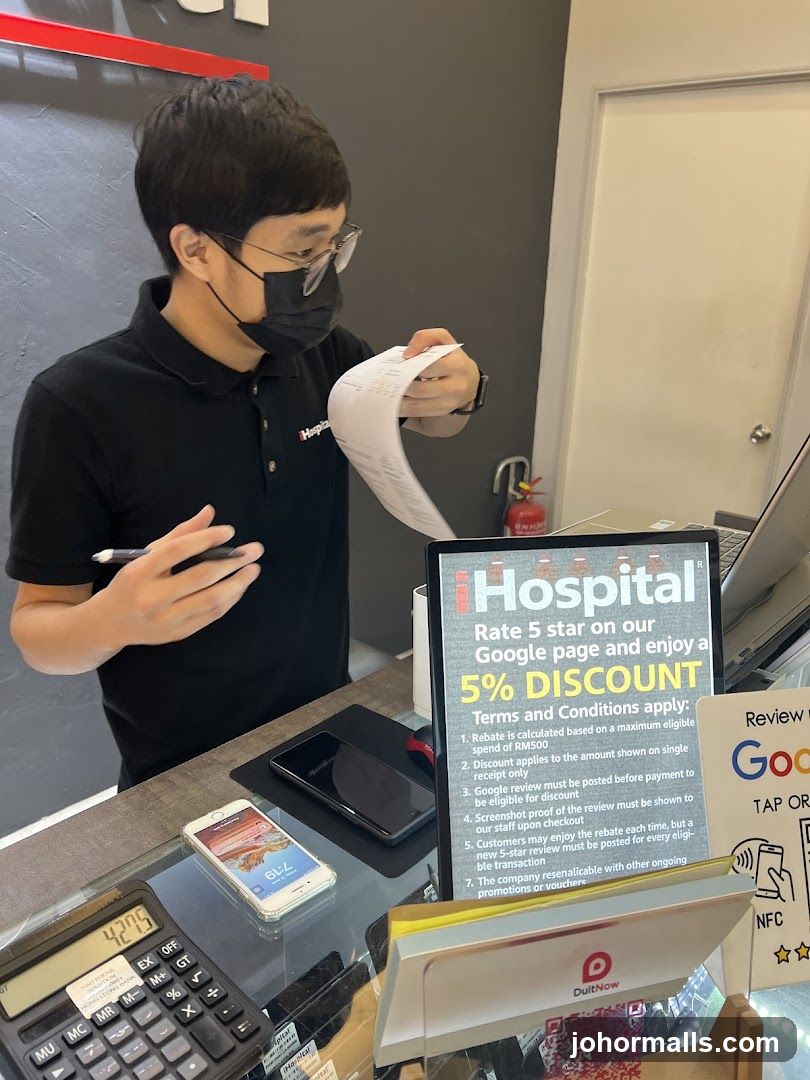 Staff reviewing receipt at counter