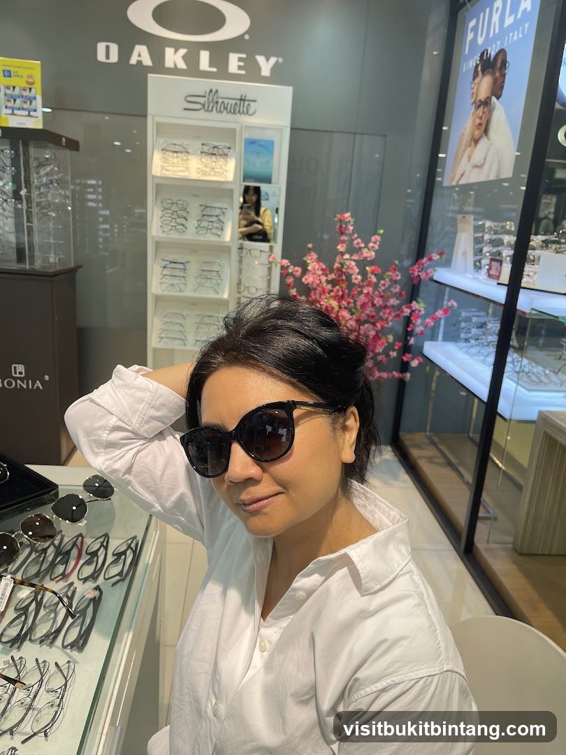 Woman trying on sunglasses