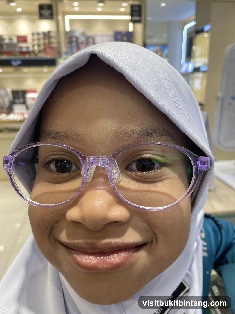 Young girl trying on glasses