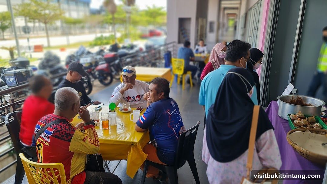 Outdoor dining area with people and food