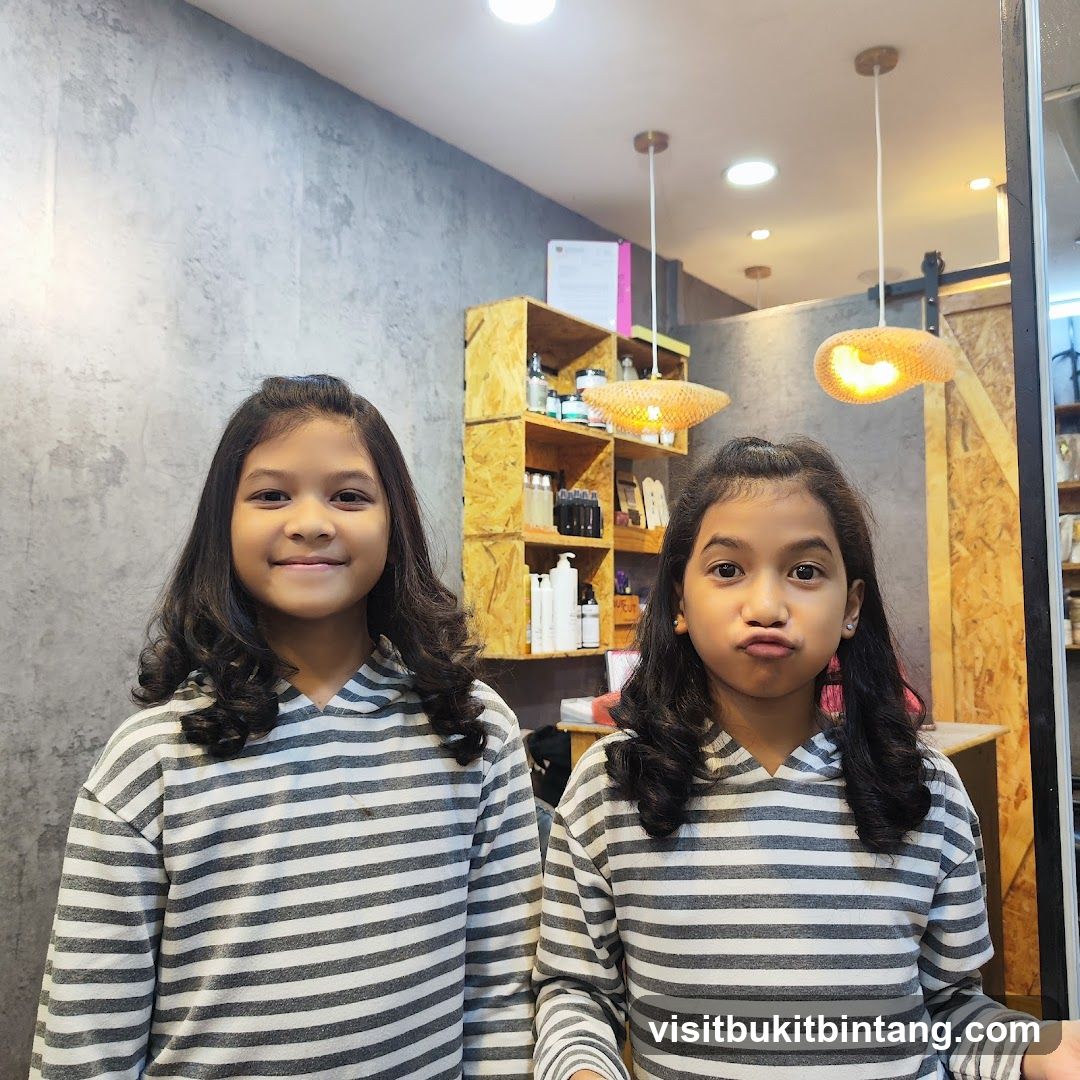 Two girls in striped hoodies