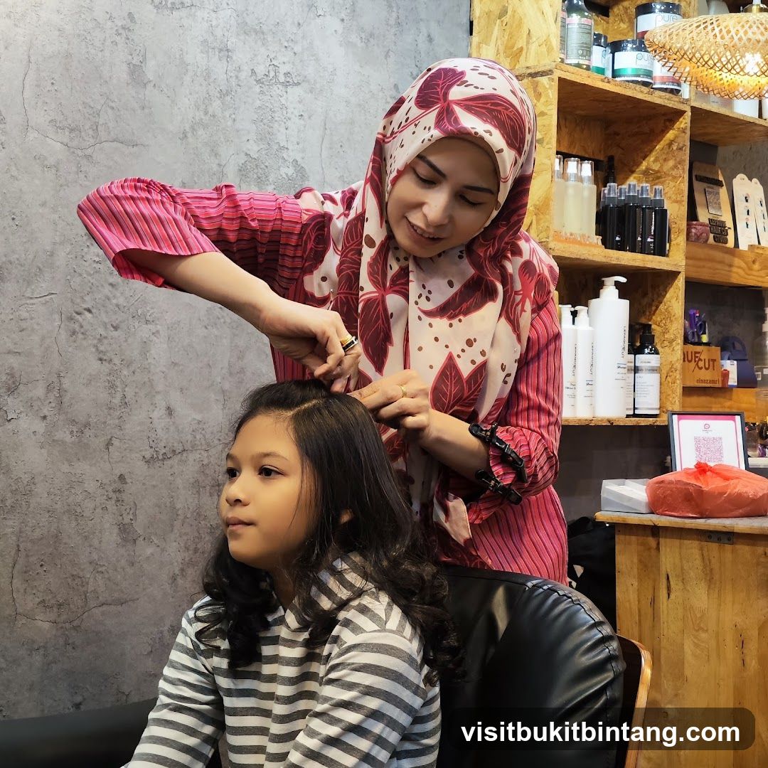 Hairdresser styling a child's hair