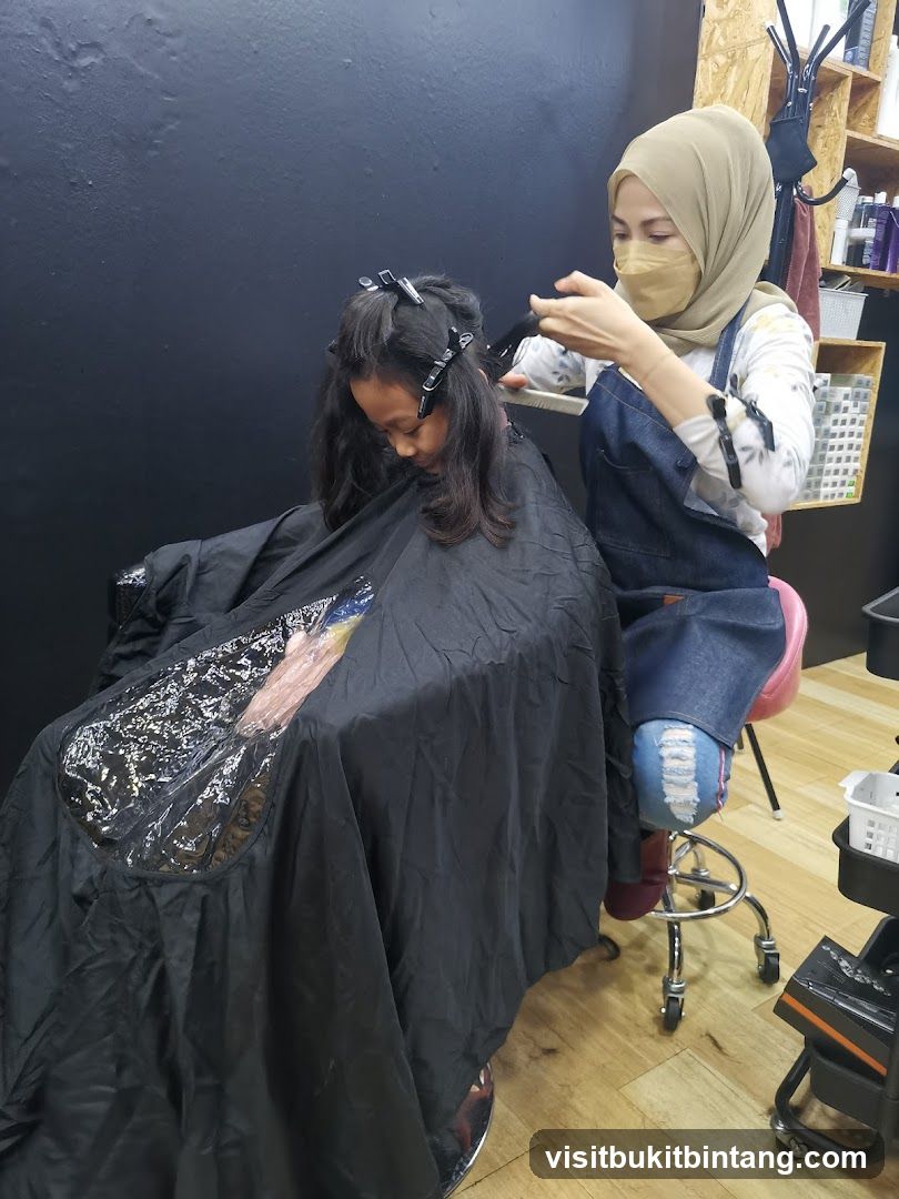 Hairdresser cutting a child's hair