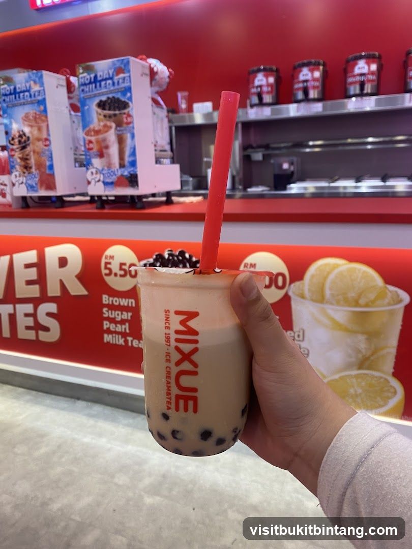 Person holding a bubble tea drink