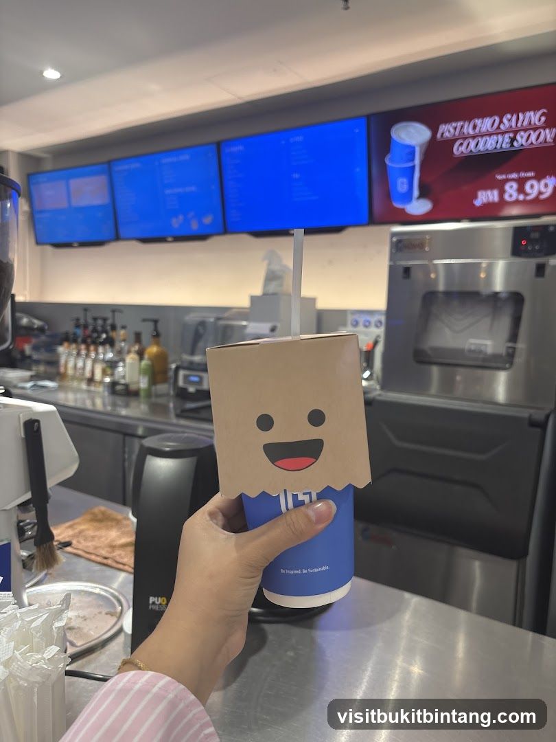Coffee cup with a cartoon face sleeve