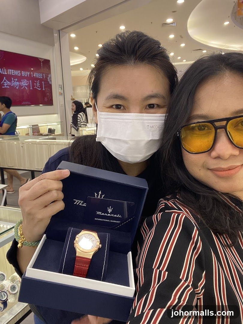 Two women with a Maserati watch