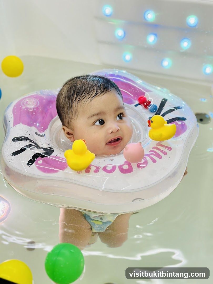 Baby in a bathtub with a swim ring